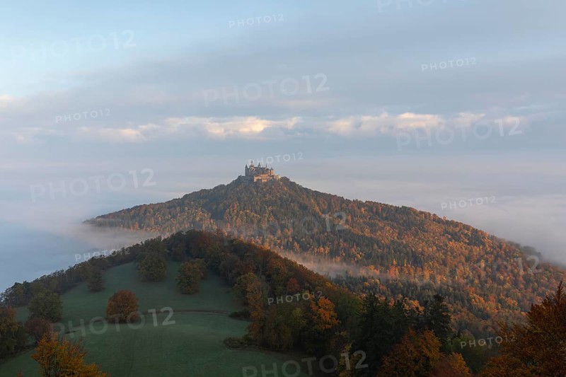 Hohenzollern Castle in a sea of fog at sunrise, autumn in the Swabian Jura
