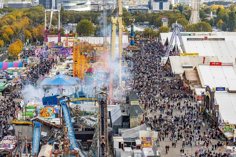 The 178th Cannstatter Volksfest on the Wasen attracted 4.2 million visitors. The Wasenrummel is one of the most important traditional festivals in Germany. In the background is the headquarters of Mercedes-Benz Group AG. Bad Cannstatt, Stuttgart, Baden-Württemberg, Germany