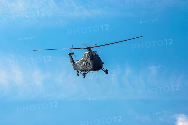 A Sikorsky S-58C transport helicopter in the colours of the German Army with the registration D-HAUG during a flight demonstration as part of an air show at the Rossfeld in Metzingen-Glems, Baden-Württemberg, Germany, for editorial use only