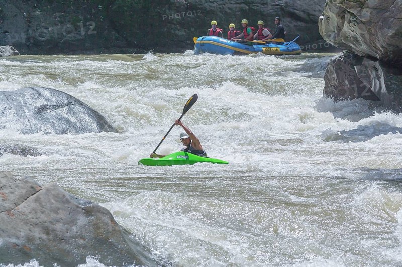 Young man kayaking in river, Costa Rica, Central America
