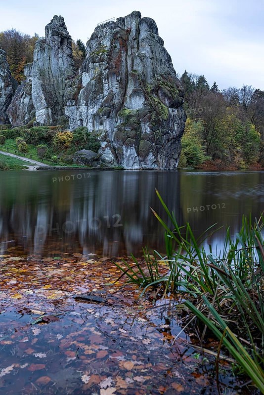 Externsteine in autumn, view over the Wiembecke pond, Teutoburg Forest, Horn-Bad Meinberg, North Rhine-Westphalia, Germany