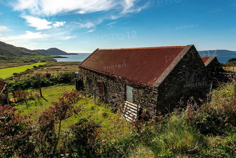 Stone farm buildings with rusty corrugated iron roof, Ring of Kerry, Iveragh Peninsula, County Kerry, Ireland