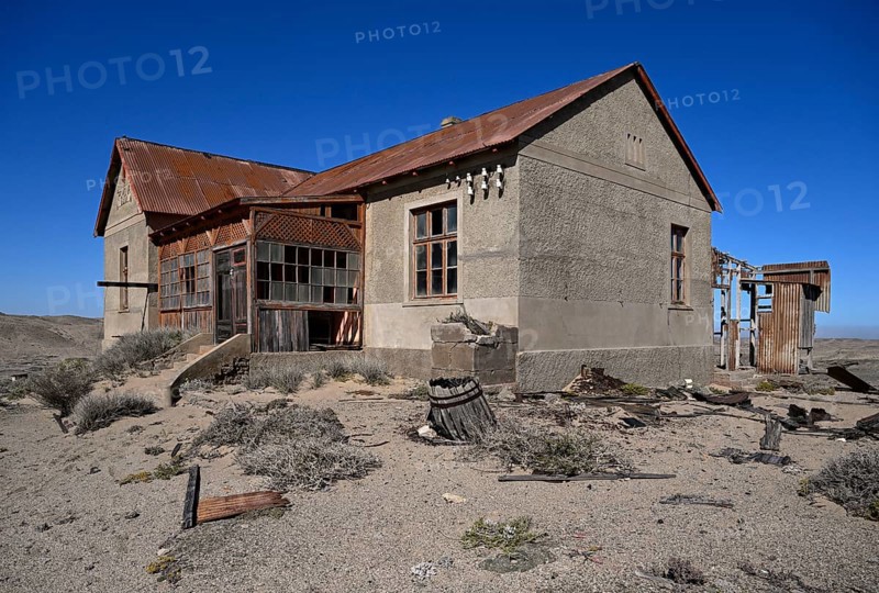 Dilapidated building in the desert sand, Pomona, restricted diamond area, near Lüderitz, Karas region, Namibia