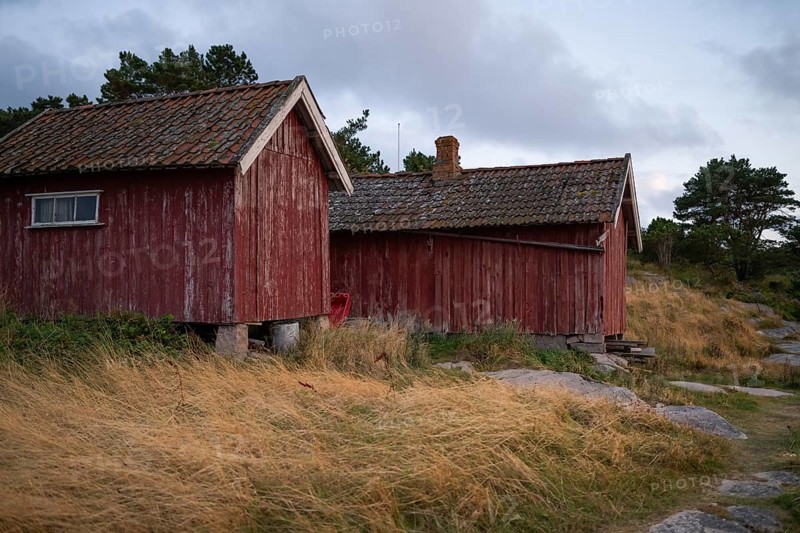 Falun red or Swedish red boathouses by the sea, Resö Island, Bohuslän, Skagerrak, Sotenäs, Västra Götalands län, Sweden