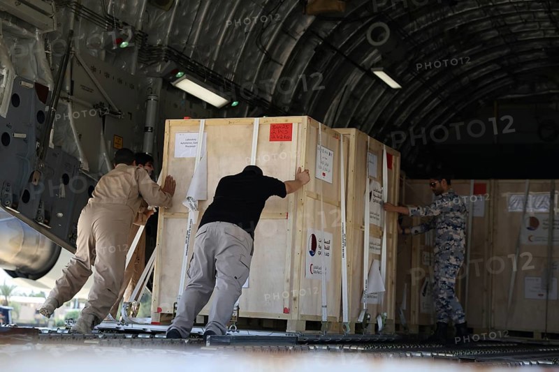 Members of the Qatari Air Force unload humanitarian aid supplies from a transport aircraft at Damascus International Airport as part of Qatar's air and land relief bridge to Syria, Damascus, Damascus, Syria