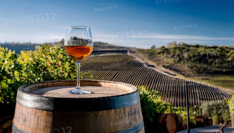 Glass of 10-year-old tawny wine placed on a barrel in a vineyard restaurant, AI generated