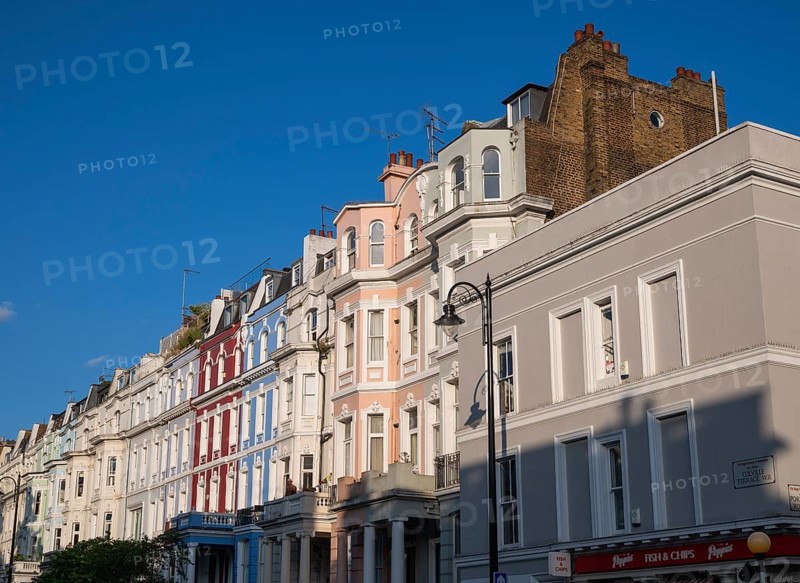 Terraced houses, townhouses with different, colourfully painted facades under a blue sky, Portobello Road, Notting Hill, London, England, Great Britain