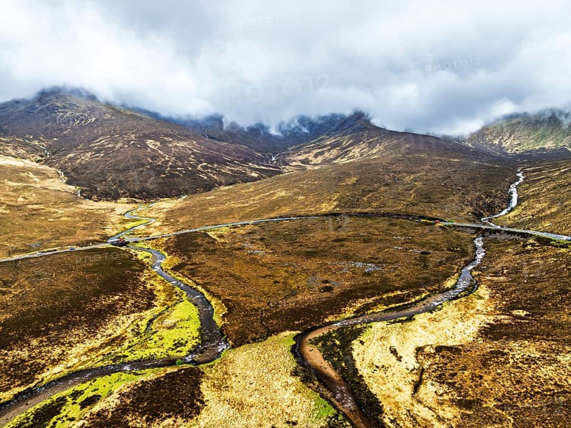 Eas a' Bhradain Waterfall from drone, Red Cuillin mountains, Loch Ainort, Isle of Skye, Scotland, UK