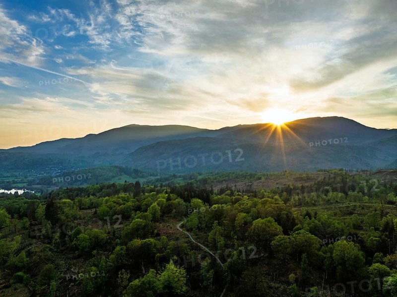 Sunset over Mountains and Coniston Water from drone, Lake District National Park, Cumbria, England, United Kingdom