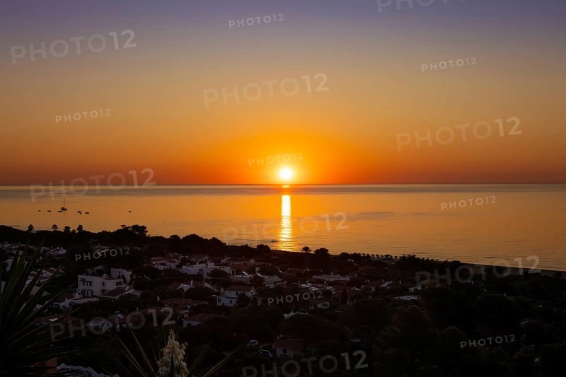 The sun rises on the Costa Rei, a stretch of coastline on the Italian Mediterranean island of Sardinia, Monte Nai, Costa Rei, Sardinia, Italy
