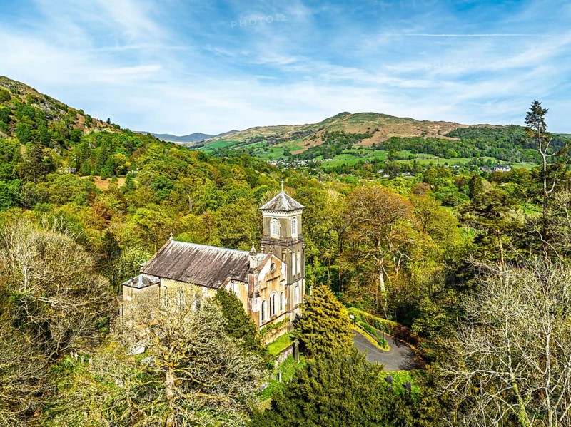 Holy Trinity Church from a drone, Bog Lane, Brathay village, Lake District, Cumbria, England, United Kingdom