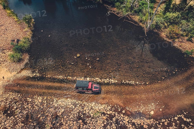 Landrover crosses river in Australian outback in the Kimberley, North West Australia, Australia