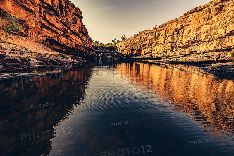 Bell Gorge waterfall, a body of water in north-west Australia in the Kimberley. Sunrise in the outback, Australia