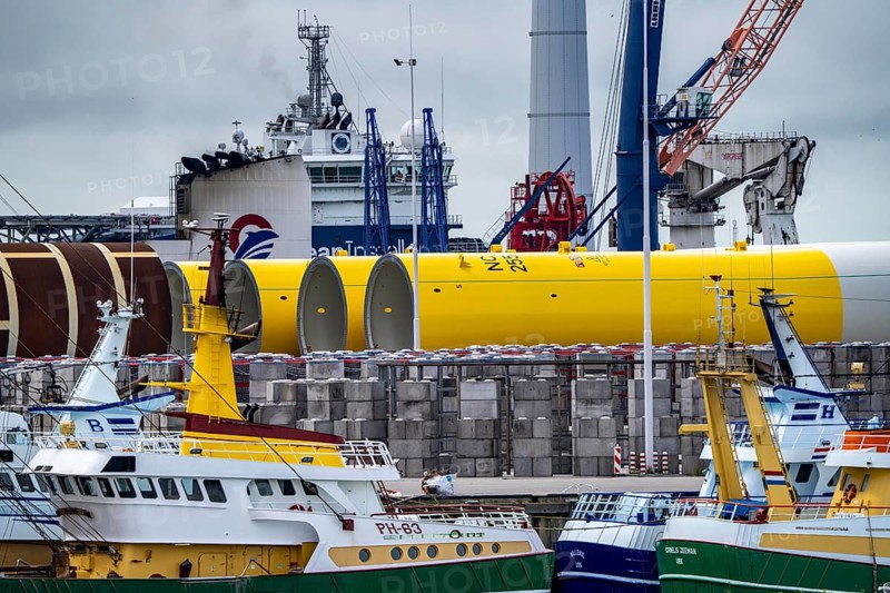 The seaport of Eemshaven, Julianahaven Basin, where the foundation structures, monopiles, for offshore wind farms are stored, which then support the actual wind turbines, the components are transported to the wind farms in the North Sea on large workboats and anchored to the seabed, where the wind turbines are then built, Eemshaven, Netherlands