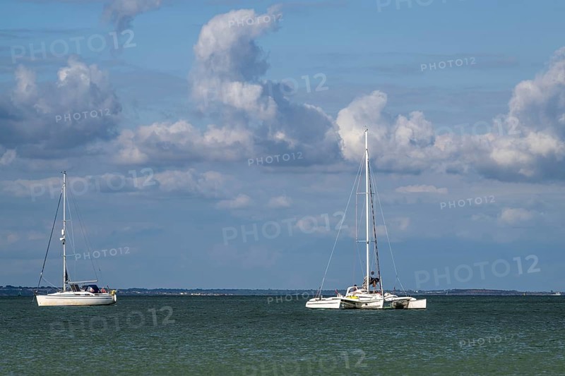 Boats on sea over Knoll Beach Studland, Poole, Dorset, England, United Kingdom