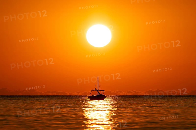 The sun rises on the Costa Rei, a stretch of coastline on the Italian Mediterranean island of Sardinia, Monte Nai, Costa Rei, Sardinia, Italy