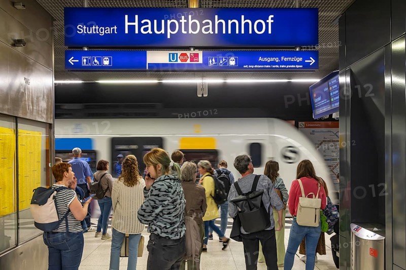 Stuttgart main station with S-Bahn. People on the platform waiting for their train. Stuttgart, Baden-Württemberg, Germany