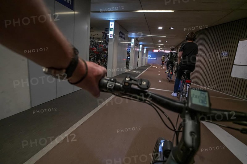 Ride your bike into and out of the bicycle car park at Utrecht Centraal station, Stationsplein, over 13, 000 parking spaces, considered the largest bicycle car park in the world, over 3 underground floors, Utrecht, Netherlands