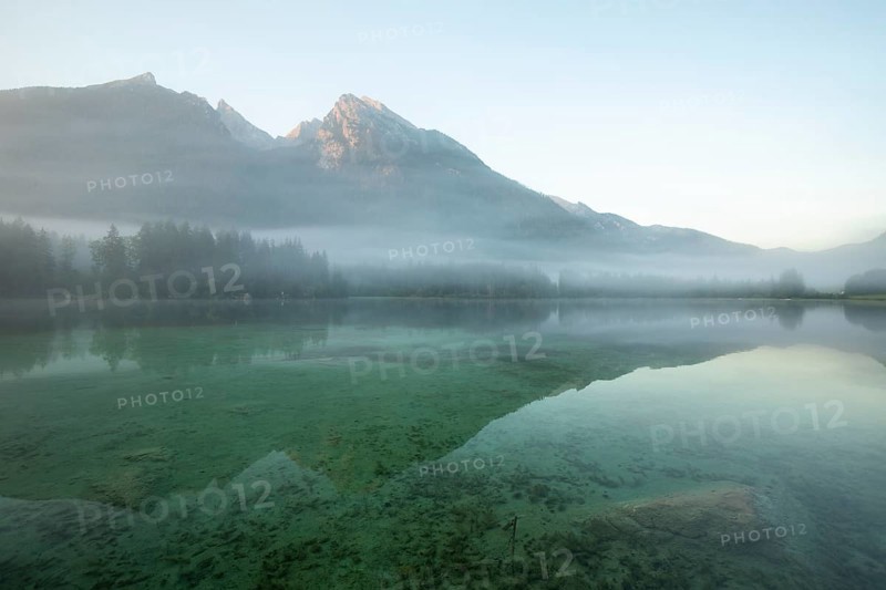 Magical sunrise with fog at Hintersee near Ramsau in Berchtesgadener Land