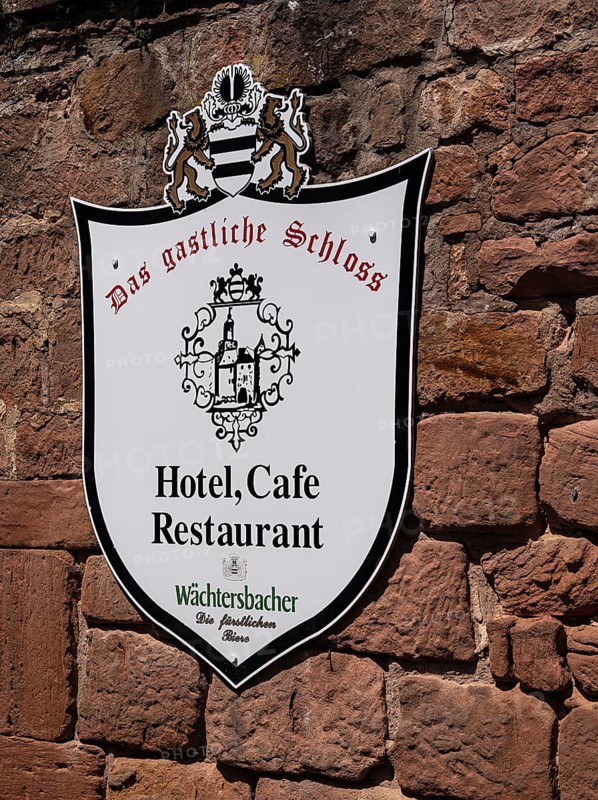 The old castle with Barbarossaplatz and the castle café in the old town centre of Büdingen, Hesse, Germany