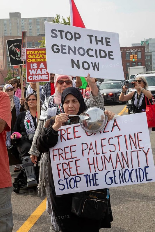 Detroit, Michigan USA - 26 July 2025 - Protesters rally at Eastern Market, banging empty pots to protest starvation in Gaza