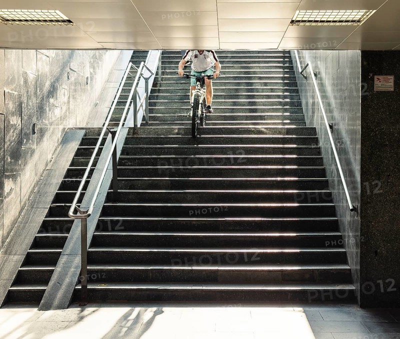 A cyclist descends a staircase on a mountain bike, Capital of Culture 2026, Trencín, Slovakia