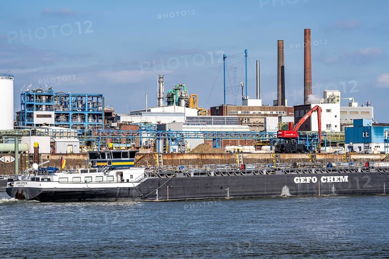 Scenery of Chempark Leverkusen, Bayer Leverkusen, chemical park, chemical plant, river Rhine, cargo ship, North Rhine-Westphalia, Germany