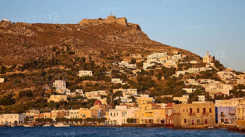 Panteli Fortress, Greek village on a hillside at dusk, historic buildings in front of a fortress overlooking the sea, Agia Marina, Leros, Dodecanese, Greek Islands, Greece