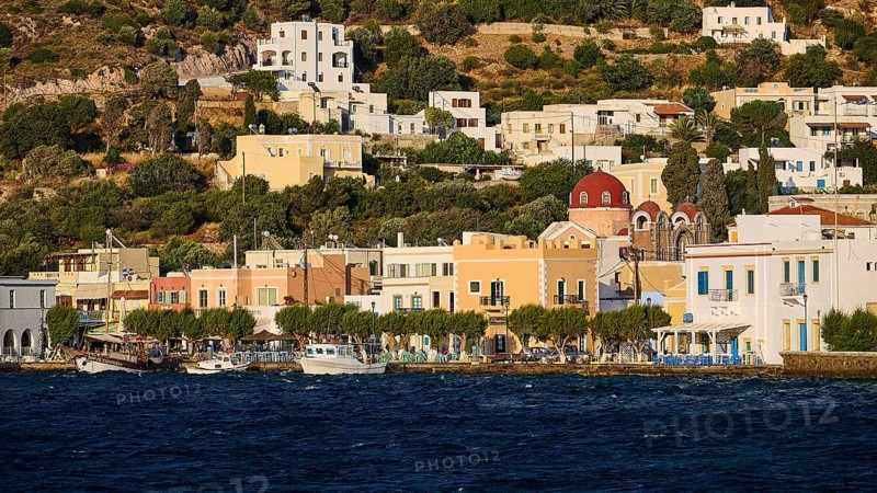 Colourful houses of a coastal village with hills in the background and water in the foreground, Agia Marina, Leros, Dodecanese, Greek Islands, Greece