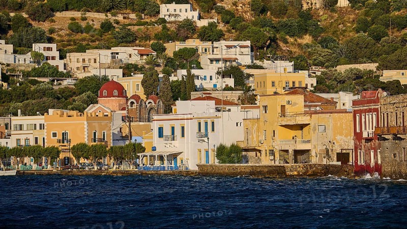 Colourful coastal houses with church in the background, located directly on the water, Agia Marina, Leros, Dodecanese, Greek Islands, Greece