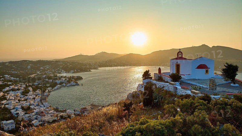 Profitis Ilias Church, Small church on a hill overlooking the calm sea at sunset, surrounded by a picturesque village, Ormos Alintas, Agia Marina, Leros, Dodecanese, Greek Islands, Greece