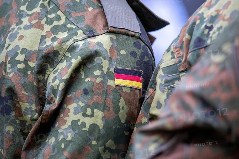 Bundeswehr symbolic image: close-up of the German flag on the Bundeswehr uniform