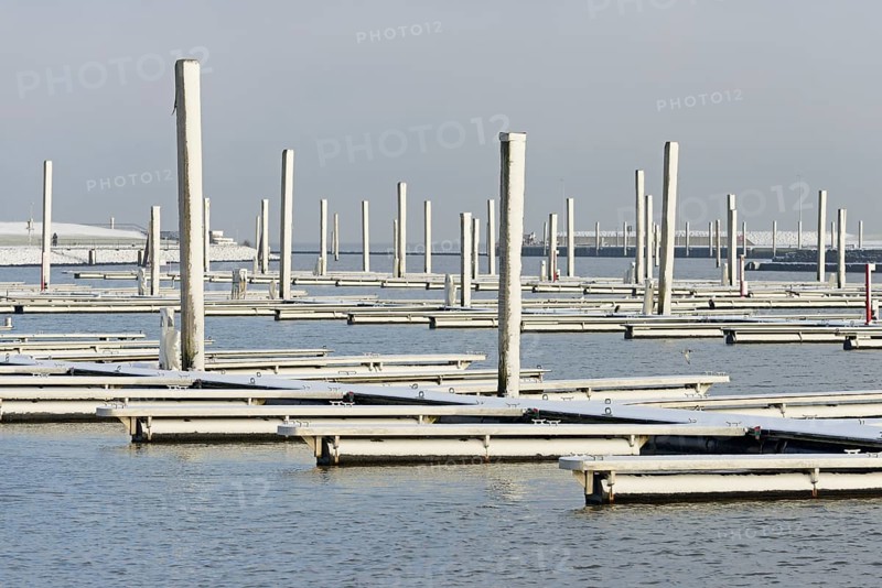 Winter day, onset of winter, snow on the jetties in the marina, North Sea, Norddeich, Lower Saxony, Germany