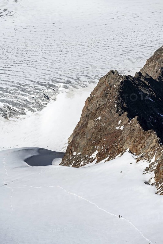 Mountaineer in the distance on the Übeltalferner glacier, Stubai Alps, South Tyrol, Italy