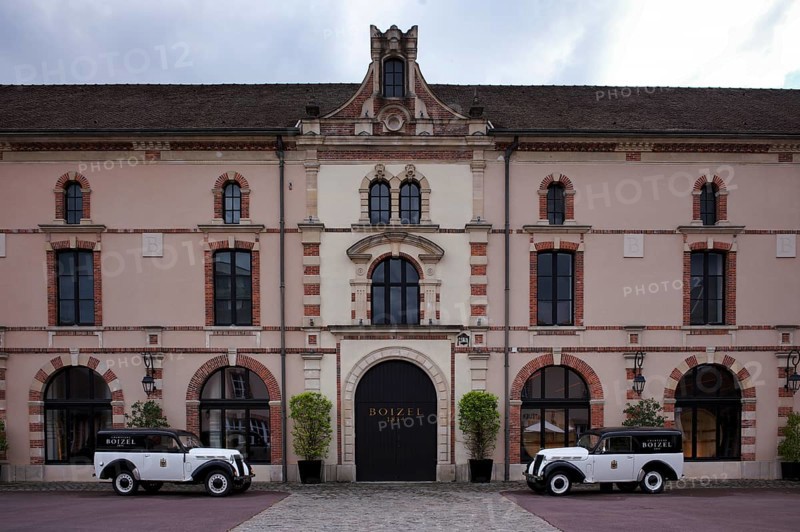 Black and white Renault Juvaquatre Editorial vintage cars in front of headquarters, head office, Atelier 1834 Champagne Boizel, Avenue de Champagne, Épernay, Marne, France