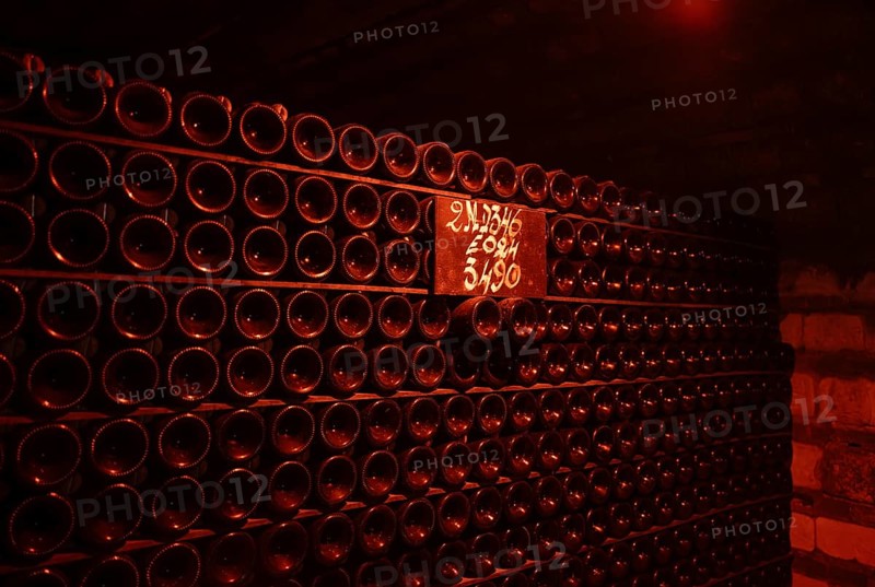 Champagne bottles, bottles stored in the cellar, champagne cellar of Moët & Chandon (Les Caves Moët & Chandon) Headquarters of the champagne brand Moët & Chandon, part of the luxury goods group LVMH Louis Vuitton Moët Hennessy, Avenue de Champagne, Épernay, Marne, France