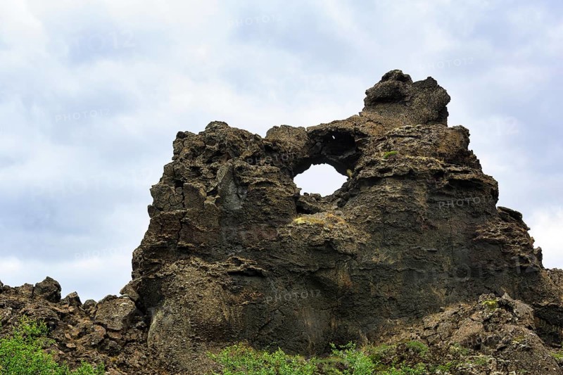 Dimmuborgir, bizarrely shaped rock formation, rock arch in the lava field, Krafla volcano system, Dimmuborgir National Park, Mývatn, Iceland