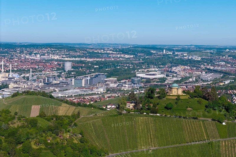 Panoramic picture of a cityscape with a building on a vineyard hill, view of the burial chapel of Stuttgart-Rotenberg, in the background the Mercedes-Benz plant in Stuttgart-Untertürkheim and the MHP Arena, Baden-Württemberg, Germany