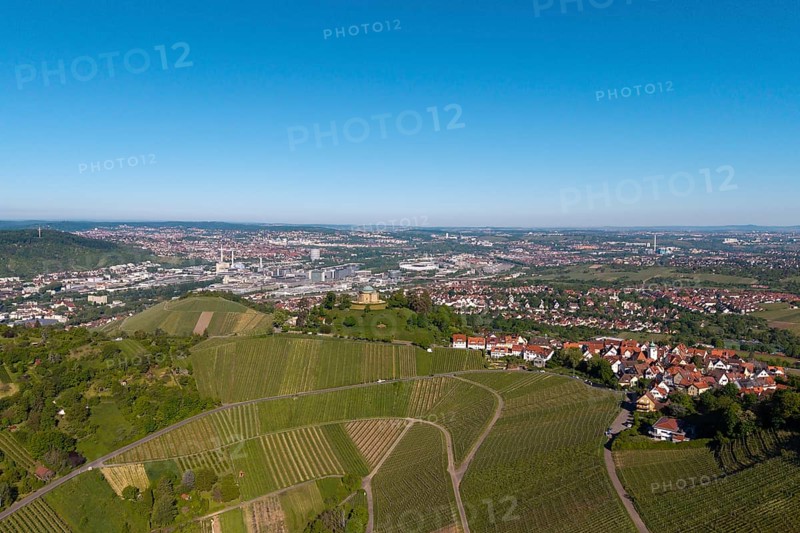 Aerial view of a vineyard with a view of a town and industrial plants in the background, view of Rotenberg near Stuttgart with a burial chapel, in the background the Mercedes-Benz plant in Stuttgart-Untertürkheim and the MHP Arena, Baden-Württemberg, Germany