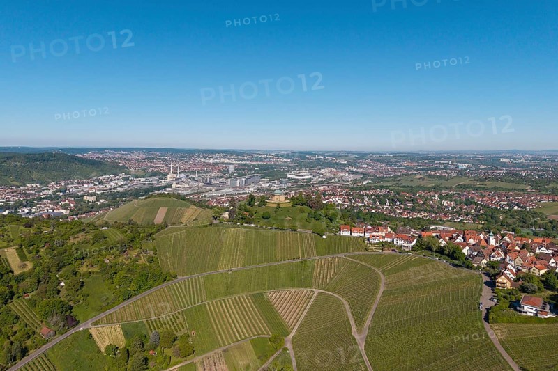 Urban surroundings with vineyards and buildings under a blue sky, view of Rotenberg near Stuttgart with a burial chapel, in the background the Mercedes-Benz plant in Stuttgart-Untertürkheim and the MHP Arena, Baden-Württemberg, Germany