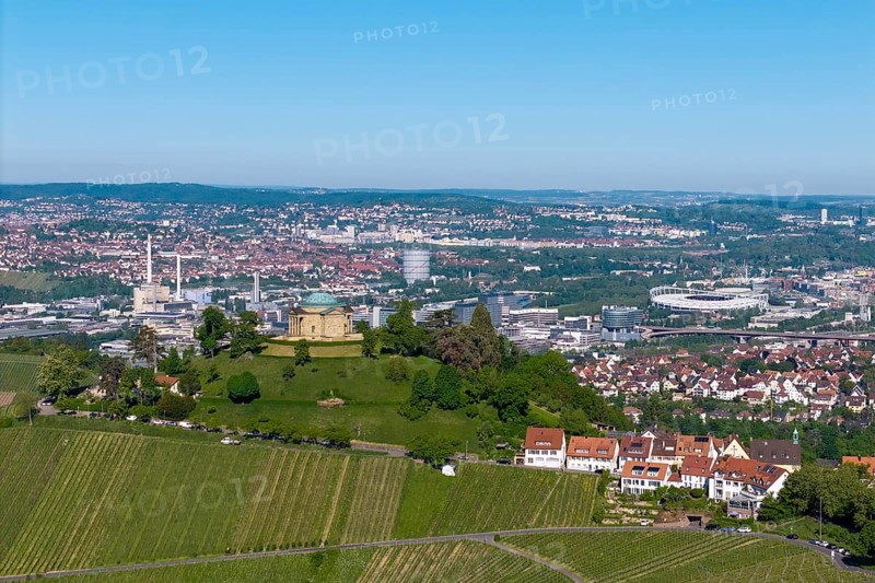 Vineyards and a hilltop building in front of a detailed city panorama, view of Rotenberg near Stuttgart with a burial chapel, in the background the Mercedes-Benz plant in Stuttgart-Untertürkheim and the MHP Arena, Baden-Württemberg, Germany