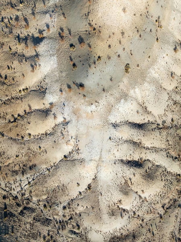 Broken, rocky ground with sparse vegetation. Aerial view. Drone shot. Southern Namibia