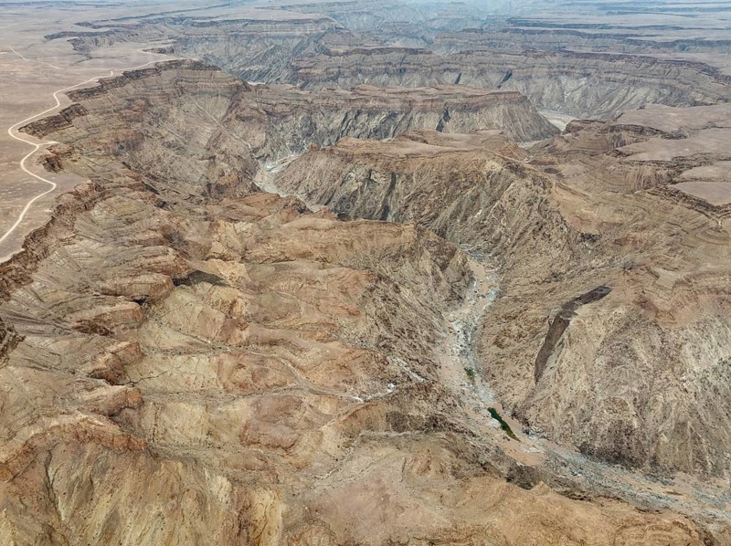 The Fish River Canyon with a length of 160 km is the second largest canyon in the world and the largest in Africa. Aerial view. Drone shot. Ai-Ais Richtersfeld Transfrontier Park, Namibia