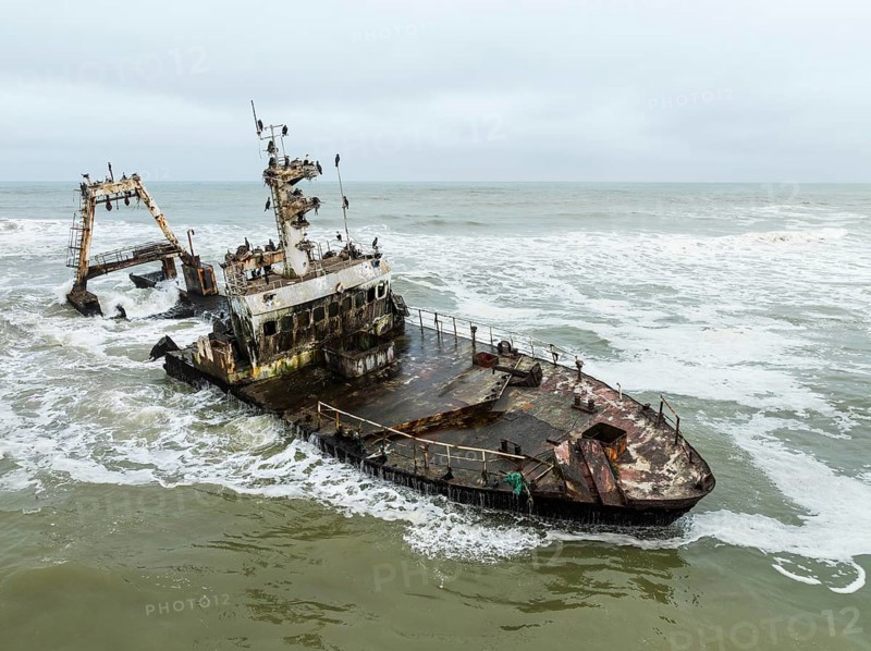 White-breasted Cormorant (Phalacrocorax lucidos). Nesting on the Zeila shipwreck at the Skeleton Coast. Aerial view. Drone shot. Dorob National Park, Namibia
