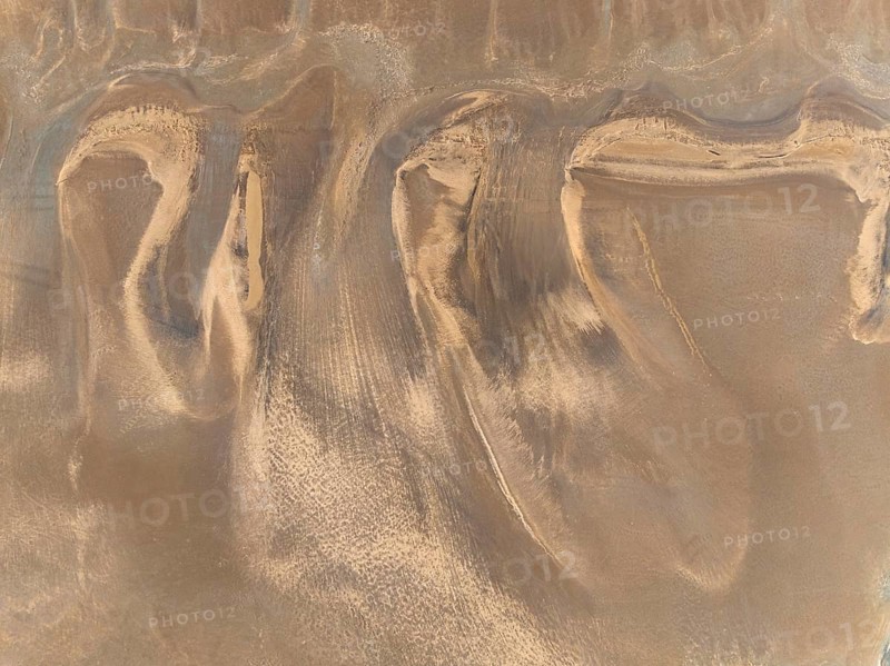Low tide patterns in the ground of the Walvis Bay Lagoon. Aerial view. Drone shot. Namibia