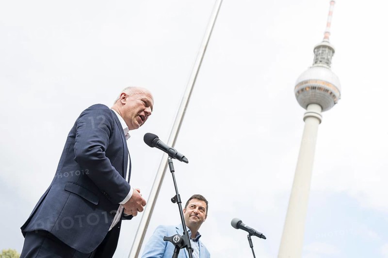 Kai Wegner (Governing Mayor of Berlin) and Florian Winkler-Schwarz, Managing Director of the Lesbian and Gay Association (LSVD) Berlin Brandenburg, give a speech in front of the raising of the rainbow flag for Pride Week in front of the Rotes Rathaus in Berlin on 9 July 2025