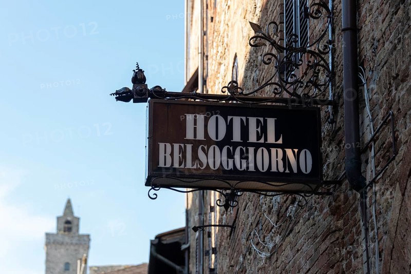 Wrought iron sign of the Hotel Belsoggiorno in San Gimignano, Tuscany, Italy