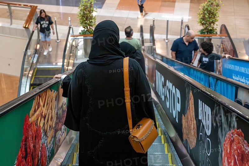 Veiled woman with handbag, Abu Dhabi, United Arab Emirates