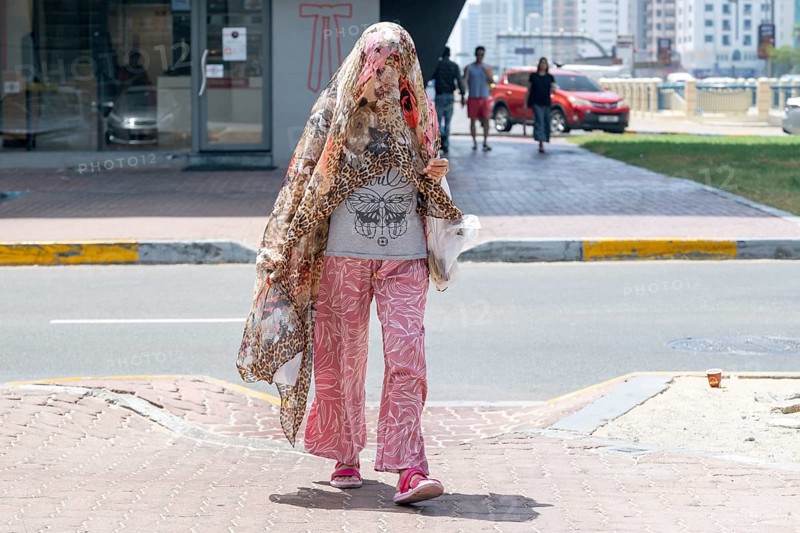 Woman fashionably veiled, Abu Dhabi, United Arab Emirates