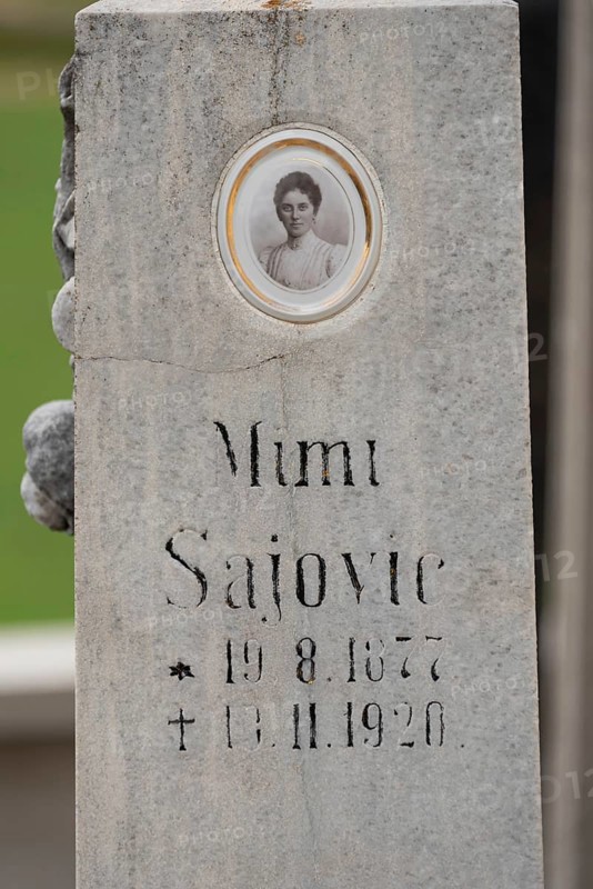Old gravestone with inscription and an oval photo portrait, Zgornje Jezersko, Gorenjska, Slovenia
